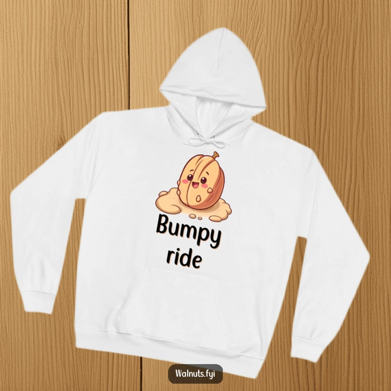 Funny hoodie depicting a surprised pecan happily rolling downhill on a textured surface.