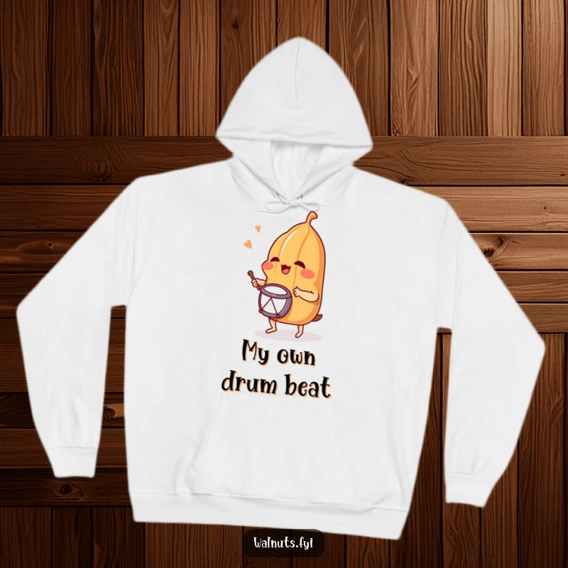 Funny hoodie featuring a happy pecan drumming with gusto, perfect for cozying up while sharing a laugh, ideal as a funny gift.