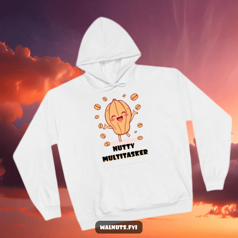 Funny hoodie with a joyful walnut character playfully juggling smaller walnut pieces, perfect for cozy fun.