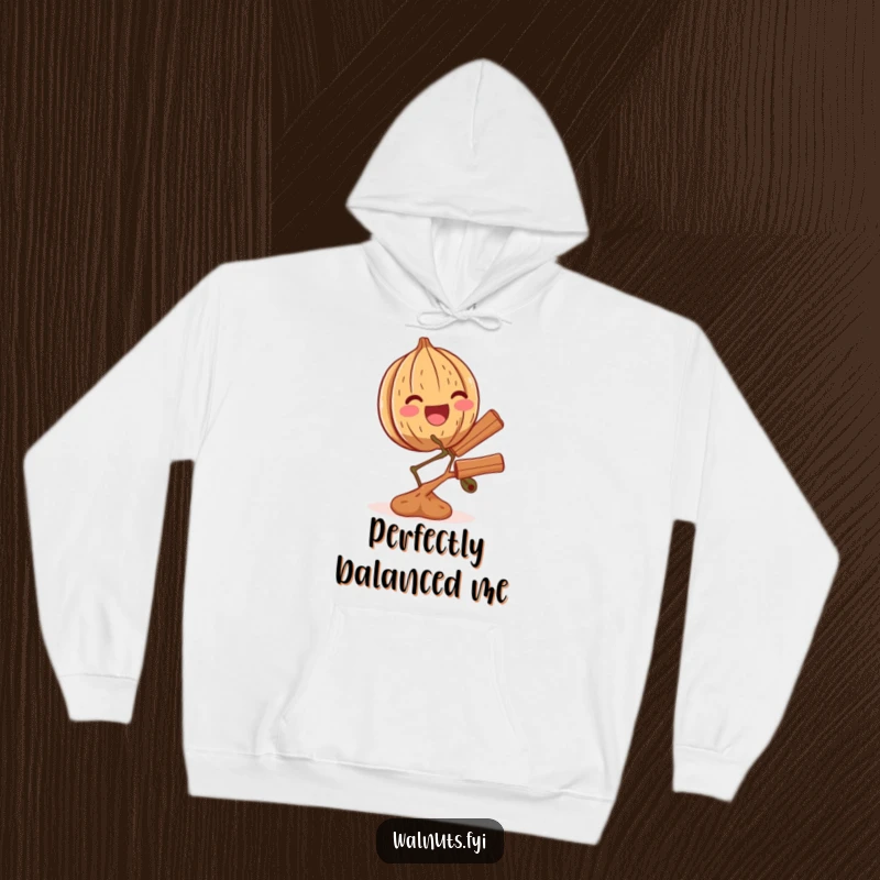 Funny hoodie graphic of an overjoyed walnut successfully balancing a small branch of cinnamon, radiating pure delight.