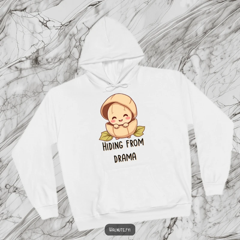 Funny hoodie with a happy walnut character peeking from behind a large shell, perfect for cozy moments.