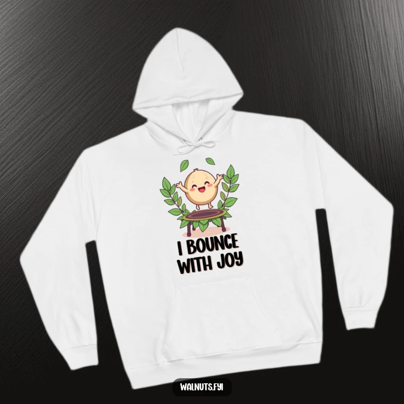 Funny hoodie with a happy, round walnut character bouncing enthusiastically on a trampoline made of leaves.