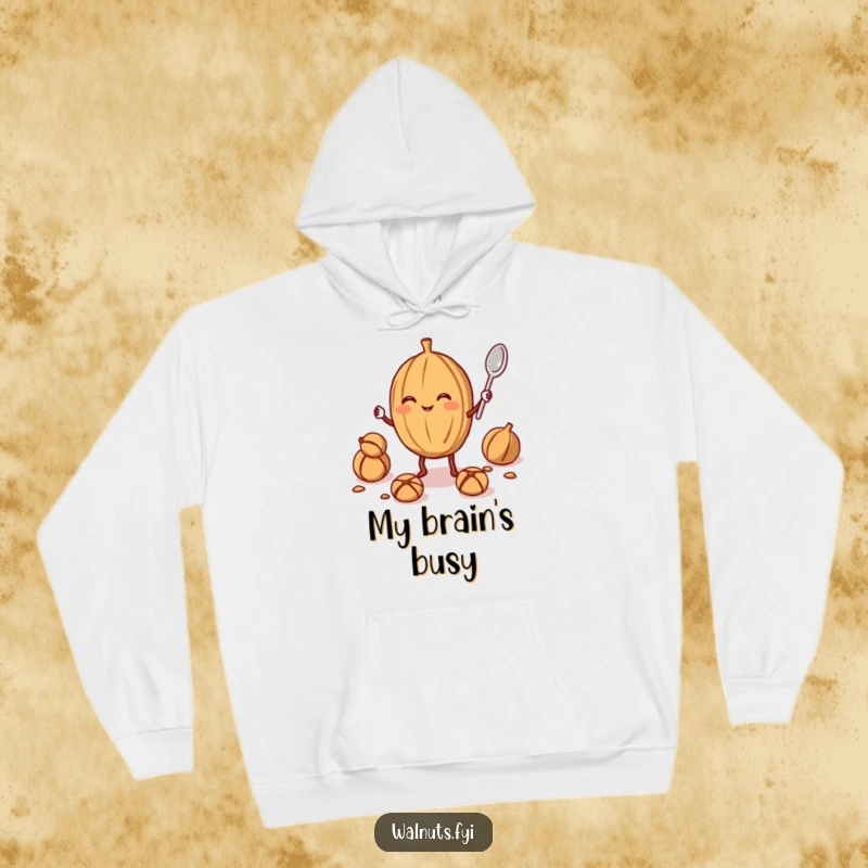 Funny walnut juggler hoodie featuring a smiling walnut juggling a smaller walnut and a spoon, offering warmth and nutty humor.