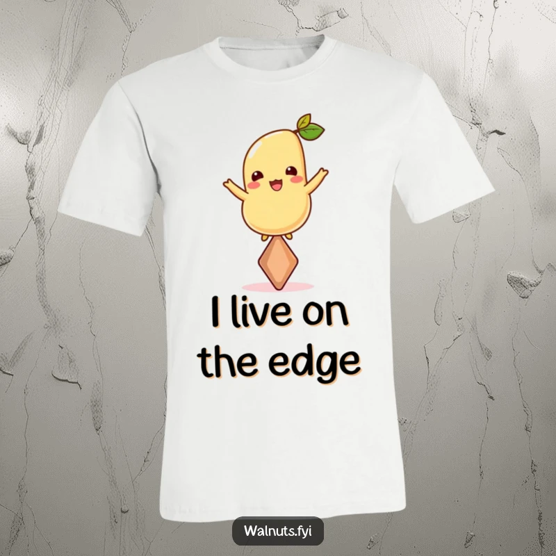 Funny T-shirt depicting a joyful cashew balancing perfectly on its sharp point, embodying grace and nutty resilience.